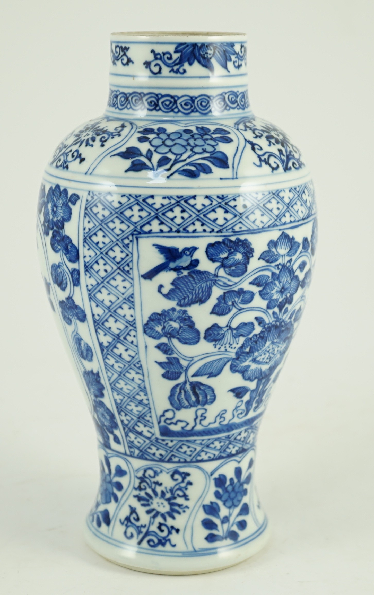 A Chinese blue and white vase, Kangxi period, 21cm high, hairline crack to neck